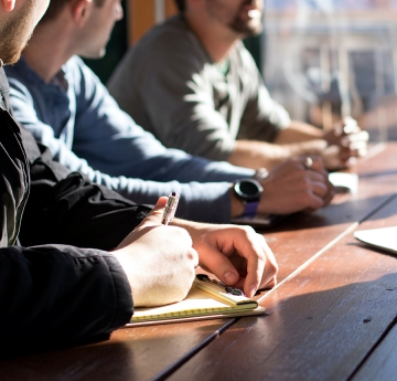 People in a meeting at a table